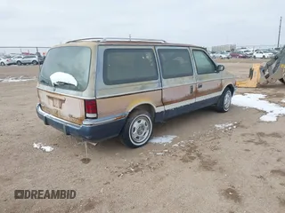 1991 Dodge Grand Caravan with VIN 1B4GK54R4MX558183, listed as a IAAI auction lot 41604086 with 210,400 mi miles and . Bid and sale history available at DreamBid. Image 4.