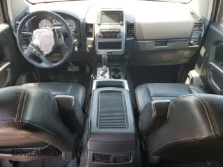 2015 Nissan Titan Pro-4X with VIN 1N6BA0EC5FN506358, listed as a Copart auction lot 56671205 with 153,712 mi miles and Salvage title. Bid and sale history available at DreamBid. Image 8.