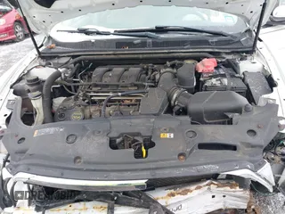 2015 Ford Taurus SEL with VIN 1FAHP2E85FG152256, listed as a IAAI auction lot 41971204 with 120,102 mi miles and . Bid and sale history available at carsss.com. Image 10.
