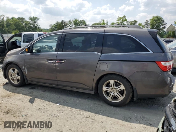 2011 Honda Odyssey Touring with VIN 5FNRL5H91BB045838, listed as a Copart auction lot 59612315 with Not provided miles and Salvage title. Bid and sale history available at DreamBid. Image 2.