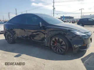 2022 Tesla Model Y Performance with VIN 7SAYGDEF6NF524171, listed as a Copart auction lot 60736945 with 30,629 mi miles and Salvage title. Bid and sale history available at DreamBid. Image 4.