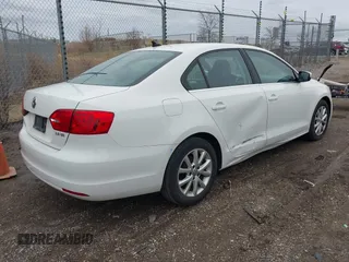 2013 Volkswagen Jetta Sedan SE w/Convenience/Sunroof with VIN 3VWDX7AJ4DM295360, listed as a IAAI auction lot 41945387 with 93,465 mi miles. Bid and sale history available at carsss.com. Image 4.