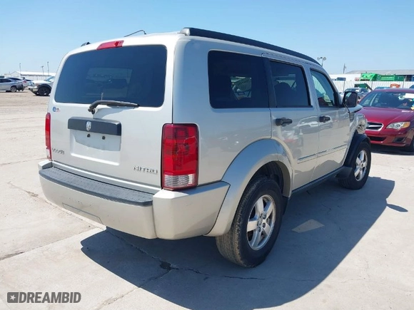 2009 Dodge Nitro SE with VIN 1D8GT28K99W513413, listed as a IAAI auction lot 39462494 with 196,456 mi miles. Bid and sale history available at carsss.com. Image 4.
