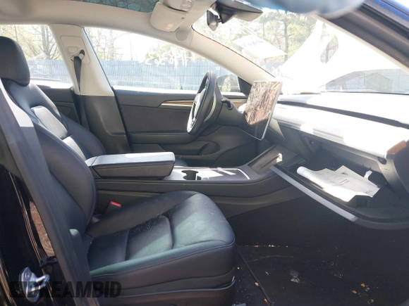 2023 Tesla Model 3 Long Range with VIN 5YJ3E1EB1PF392027, listed as a IAAI auction lot 41983638 with 31,415 mi miles and . Bid and sale history available at DreamBid. Image 5.