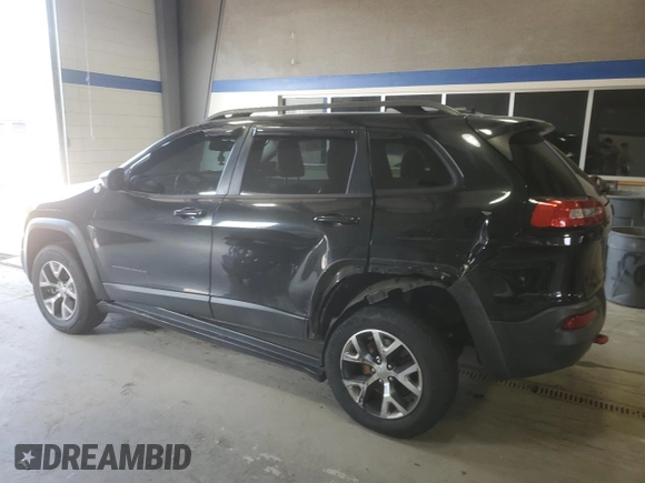 2014 Jeep Cherokee Trailhawk with VIN 1C4PJMBB8EW171116, listed as a Copart auction lot 60107215 with 168,979 mi miles and Salvage title. Bid and sale history available at DreamBid. Image 2.