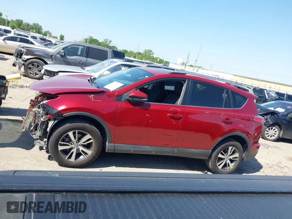 2018 Toyota RAV4 XLE with VIN 2T3WFREV8JW425464, listed as a IAAI auction lot 41977877 with 142,265 mi miles and . Bid and sale history available at carsss.com. Image 14.