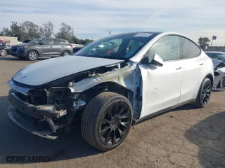 2023 Tesla Model Y Long Range with VIN 7SAYGDEE0PF631811, listed as a IAAI auction lot 41400620 with 81,358 mi miles. Bid and sale history available at carsss.com. Image 2.