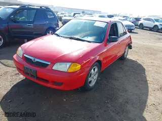 1999 Mazda Protege ES with VIN JM1BJ2210X0150191, listed as a IAAI auction lot 41577974 with 121,138 mi miles. Bid and sale history available at carsss.com. Image 18.