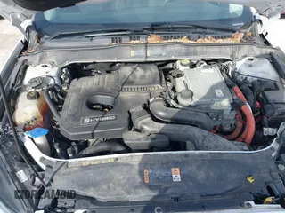 2014 Ford Fusion SE Hybrid with VIN 3FA6P0LU4ER243067, listed as a IAAI auction lot 41378720 with 129,625 mi miles. Bid and sale history available at carsss.com. Image 10.