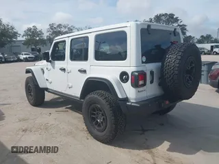 2023 Jeep Wrangler Sport S z VIN 1C4HJXDG5PW675463, wystawiony jako IAAI lot #41464572 z przebiegiem 3 379 mil mil oraz . Historia ofert i sprzedaży dostępna na DreamBid. Obrazek 3.