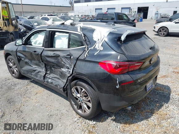 2019 BMW X2 sDrive28i with VIN WBXYJ3C58KEP77334, listed as a IAAI auction lot 42575165 with 98,910 mi miles and . Bid and sale history available at DreamBid. Image 3.