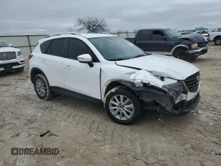 2016 Mazda CX-5 Touring with VIN JM3KE2CY9G0733933, listed as a Copart auction lot 45118885 with 149,901 mi miles and Salvage Title. Bid and sale history available at carsss.com. Image 4.