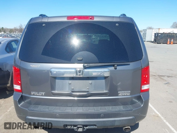 2010 Honda Pilot Touring with VIN 5FNYF4H94AB031167, listed as a IAAI auction lot 41800738 with 184,126 mi miles and . Bid and sale history available at carsss.com. Image 16.