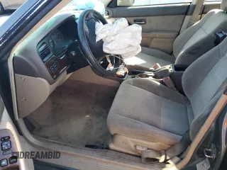 2002 Subaru Legacy Outback with VIN 4S3BH665427633764, listed as a Copart auction lot 57443145 with 210,616 mi miles and Salvage title. Bid and sale history available at DreamBid. Image 7.