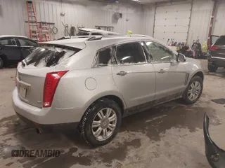 2016 Cadillac SRX Luxury Collection z VIN 3GYFNBE36GS572780, wystawiony jako IAAI lot #41347399 z przebiegiem 166 436 mil mil oraz . Historia ofert i sprzedaży dostępna na DreamBid. Obrazek 4.