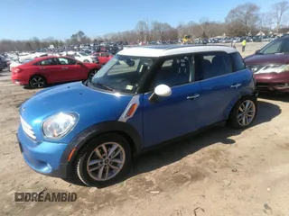 2013 MINI Cooper Countryman with VIN WMWZB3C56DWM31601, listed as a IAAI auction lot 41814031 with 139,417 mi miles. Bid and sale history available at carsss.com. Image 2.