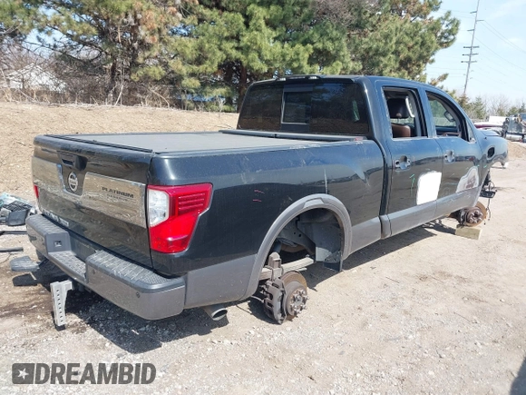 2016 Nissan Titan XD Platinum Reserve with VIN 1N6BA1F27GN506410, listed as a IAAI auction lot 41768621 with 159,404 mi miles. Bid and sale history available at carsss.com. Image 4.