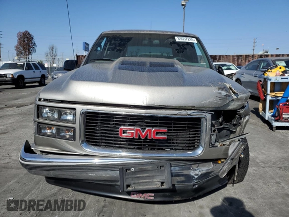 1999 GMC Yukon with VIN 1GKEC13R9XJ704929, listed as a Copart auction lot 89097295 with 87,478 mi miles and Salvage Title. Bid and sale history available at carsss.com. Image 5.