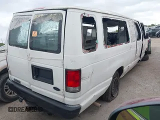 2014 Ford Econoline Wagon XL with VIN 1FBSS3BLXEDA71562, listed as a IAAI auction lot 41864794 with 140,942 mi miles. Bid and sale history available at carsss.com. Image 4.