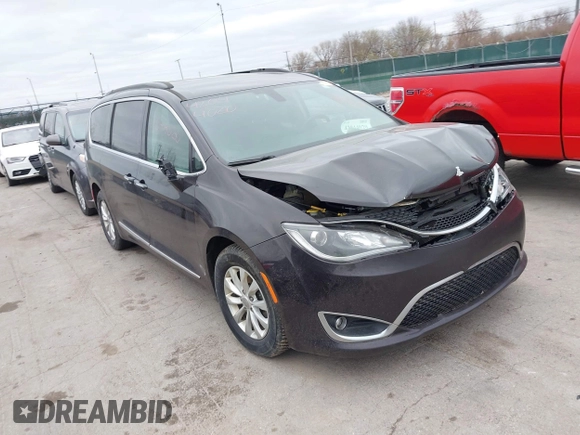 2017 Chrysler Pacifica Touring L with VIN 2C4RC1BG1HR797200, listed as a IAAI auction lot 42044020 with 124,115 mi miles and . Bid and sale history available at DreamBid. Image 1.