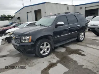 2014 Chevrolet Tahoe LTZ with VIN 1GNSCCE08ER139958, listed as a Copart auction lot 53551215 with 140,218 mi miles and Salvage title. Bid and sale history available at DreamBid. Image 1.