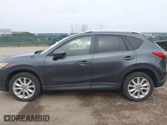 2014 Mazda CX-5 Grand Touring with VIN JM3KE4DY4E0343863, listed as a IAAI auction lot 41770402 with 117,615 mi miles. Bid and sale history available at carsss.com. Image 14.