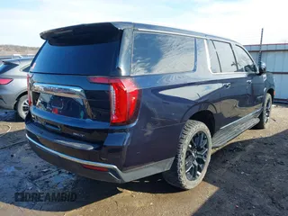 2022 GMC Yukon XL SLT with VIN 1GKS2GKDXNR134694, listed as a IAAI auction lot 41475723 with 52,579 mi miles. Bid and sale history available at carsss.com. Image 4.