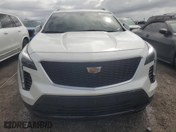 2022 Cadillac XT4 FWD Sport z VIN 1GYFZER44NF118862, wystawiony jako Copart lot #75053034 z przebiegiem 14 983 mil mil oraz Nie do naprawy • Non repairable. Historia ofert i sprzedaży dostępna na DreamBid. Obrazek 5.