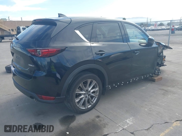 2021 Mazda CX-5 Grand Touring with VIN JM3KFBDM4M1426197, listed as a IAAI auction lot 42004644 with 43,814 mi miles. Bid and sale history available at carsss.com. Image 4.