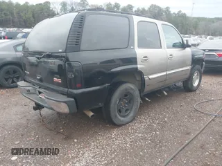 2003 GMC Yukon SLT with VIN 1GKEC13Z43J327937, listed as a IAAI auction lot 41543517 with 277,485 mi miles. Bid and sale history available at carsss.com. Image 4.