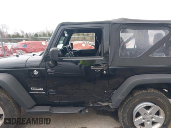 2014 Jeep Wrangler Sport with VIN 1C4AJWAG9EL312856, listed as a IAAI auction lot 42022870 with 98,323 mi miles and . Bid and sale history available at DreamBid. Image 14.