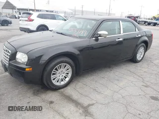 2009 Chrysler 300 LX with VIN 2C3KA43D19H506753, listed as a IAAI auction lot 42053199 with 106,092 mi miles. Bid and sale history available at carsss.com. Image 2.