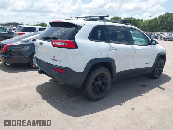 2014 Jeep Cherokee Trailhawk with VIN 1C4PJMBS5EW231448, listed as a IAAI auction lot 42632143 with 97,461 mi miles and . Bid and sale history available at DreamBid. Image 4.