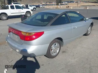 2002 Saturn SC with VIN 1G8ZY14732Z144888, listed as a IAAI auction lot 41617831 with 138,564 mi miles. Bid and sale history available at carsss.com. Image 4.