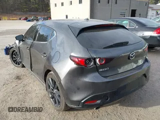 2021 Mazda 3 Premium with VIN JM1BPAML2M1310374, listed as a IAAI auction lot 41190608 with 97,648 mi miles. Bid and sale history available at carsss.com. Image 3.