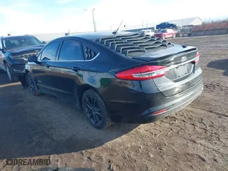 2018 Ford Fusion Hybrid SE with VIN 3FA6P0LUXJR131707, listed as a IAAI auction lot 41490634 with 129,500 mi miles. Bid and sale history available at carsss.com. Image 3.