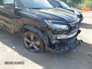 2021 Honda Passport Touring z VIN 5FNYF8H96MB014947, wystawiony jako IAAI lot #42150399 z przebiegiem 47 499 mil mil oraz . Historia ofert i sprzedaży dostępna na DreamBid. Obrazek 6.