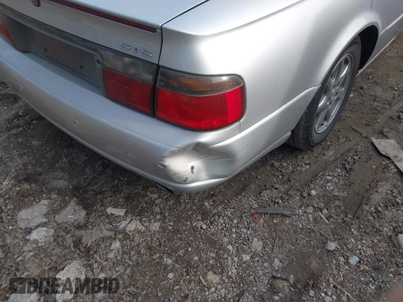 2002 Cadillac Seville Touring STS z VIN 1G6KY54902U102873, wystawiony jako IAAI lot #39710788 z przebiegiem 120 116 mil mil oraz . Historia ofert i sprzedaży dostępna na DreamBid. Obrazek 6.