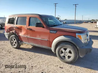 2007 Dodge Nitro SXT with VIN 1D8GU28K87W728744, listed as a Copart auction lot 77082954 with 245,632 mi miles and Salvage title. Bid and sale history available at DreamBid. Image 4.
