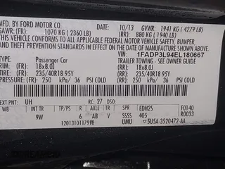 2014 Ford Focus ST with VIN 1FADP3L94EL180667, listed as a IAAI auction lot 41718746 with 141,574 mi miles and . Bid and sale history available at carsss.com. Image 9.