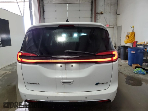 2023 Chrysler Pacifica Hybrid Touring L with VIN 2C4RC1L75PR611607, listed as a Copart auction lot 61475985 with 63,241 mi miles and Clean title. Bid and sale history available at DreamBid. Image 6.