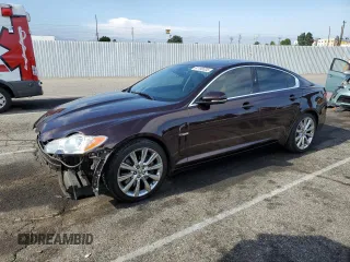 2011 Jaguar XF Premium with VIN SAJWA0GB1BLS08325, listed as a Copart auction lot 61190335 with 61,656 mi miles and Salvage title. Bid and sale history available at DreamBid. Image 1.