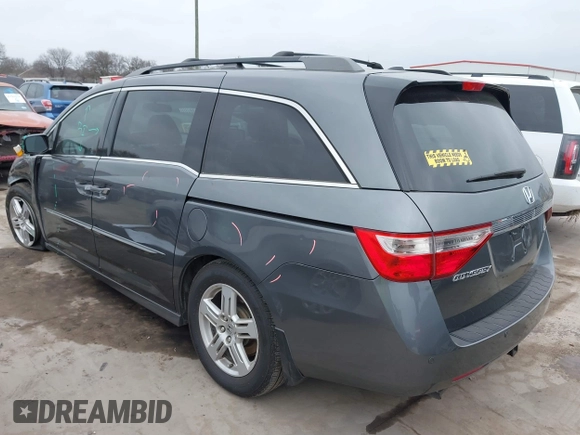 2012 Honda Odyssey Touring with VIN 5FNRL5H96CB138548, listed as a IAAI auction lot 41471856 with 186,284 mi miles and . Bid and sale history available at DreamBid. Image 3.