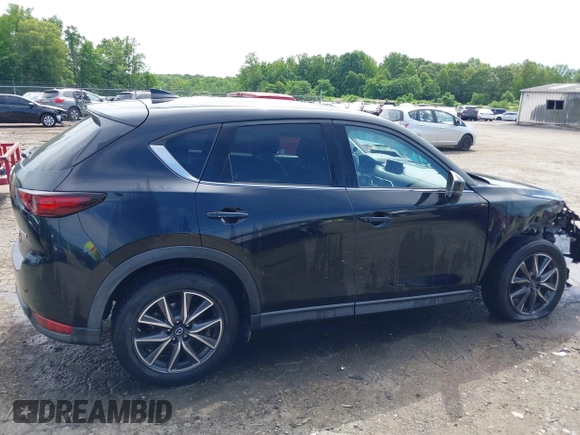 2018 Mazda CX-5 Grand Touring z VIN JM3KFBDM5J0307785, wystawiony jako IAAI lot #42302609 z przebiegiem 81 974 mil mil oraz . Historia ofert i sprzedaży dostępna na DreamBid. Obrazek 14.