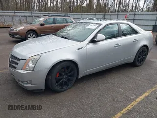 2009 Cadillac CTS AWD z VIN 1G6DH577X90135559, wystawiony jako IAAI lot #42077850 z przebiegiem 175 345 mil mil oraz . Historia ofert i sprzedaży dostępna na DreamBid. Obrazek 17.