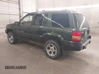 1997 Jeep Grand Cherokee Limited with VIN 1J4GZ78Y0VC684023, listed as a IAAI auction lot 42090436 with 310,831 mi miles. Bid and sale history available at carsss.com. Image 3.