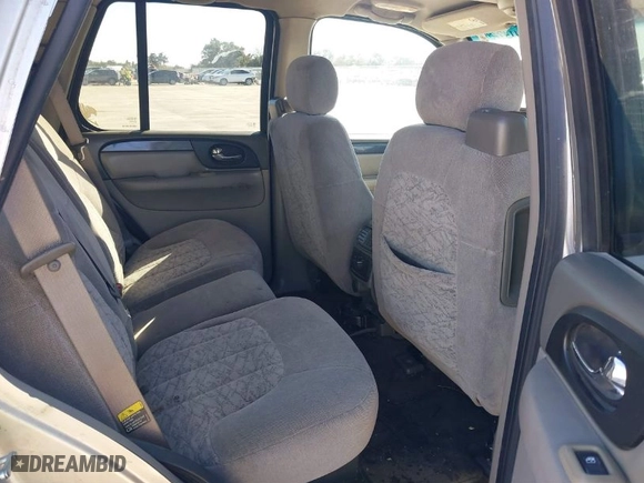 2004 GMC Envoy SLE with VIN 1GKDS13S642247715, listed as a IAAI auction lot 41472984 with 240,550 mi miles. Bid and sale history available at carsss.com. Image 8.