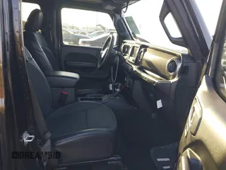 2023 Jeep Wrangler Sport S with VIN 1C4HJXDG2PW582318, listed as a IAAI auction lot 42011653 with 25,338 mi miles and . Bid and sale history available at DreamBid. Image 5.