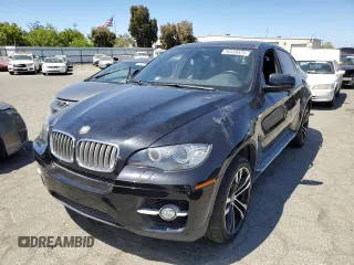 2011 BMW X6 50i with VIN 5UXFG8C55BLZ96648, listed as a Copart auction lot 56528574 with 134,321 mi miles and Salvage Title. Bid and sale history available at carsss.com. Image 1.