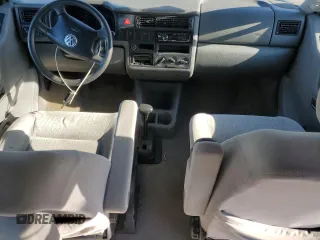 2003 Volkswagen EuroVan MV с VIN WV2NB47033H029173, выставлен на аукционе Copart как лот 82377584 с пробегом 231 083 миль миль и Чистый • Clean title. История ставок и продаж доступна на DreamBid. Изображение 8.